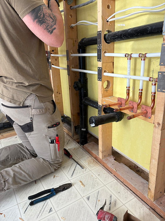 plumber Working on waterlines in Victoria Residential Complex